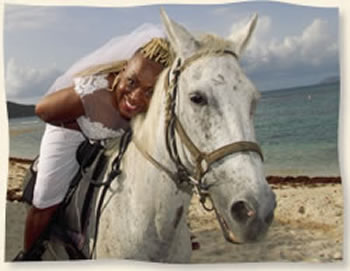 Bride on Horse after wedding with groom Lindquist Beach St Thomas Virgin Islands