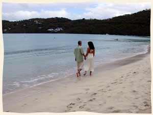 Married couple walking Magens Beach.